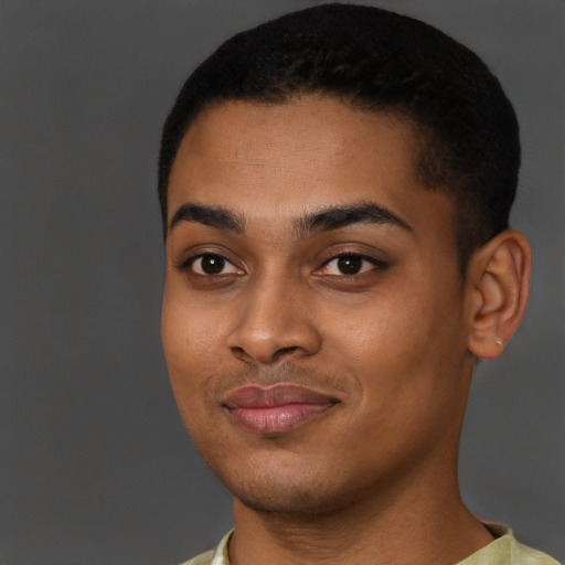 Joyful black young-adult male with short  brown hair and brown eyes