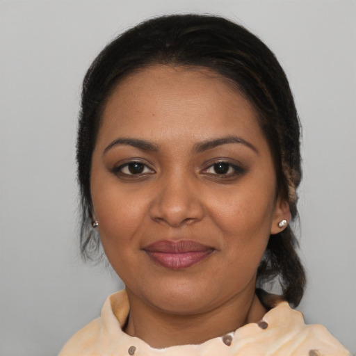 Joyful black young-adult female with medium  brown hair and brown eyes