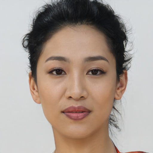 Joyful asian young-adult female with short  brown hair and brown eyes