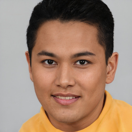 Joyful asian young-adult male with short  brown hair and brown eyes