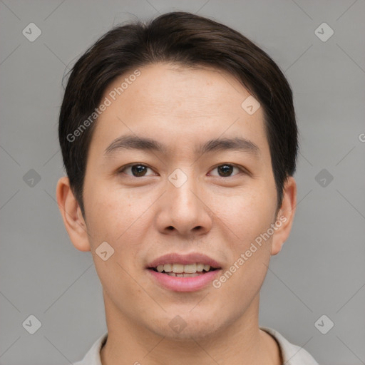 Joyful asian young-adult male with short  brown hair and brown eyes