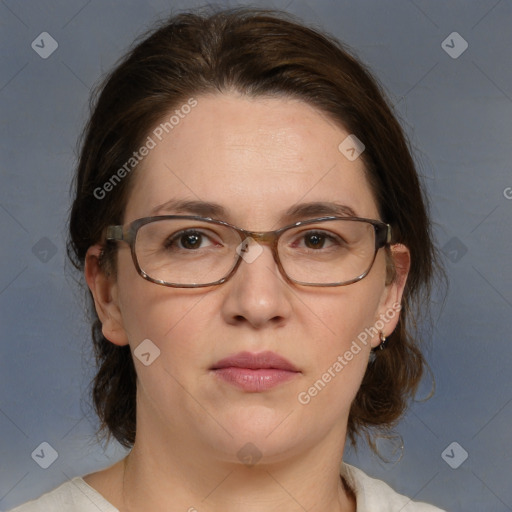 Joyful white adult female with medium  brown hair and blue eyes