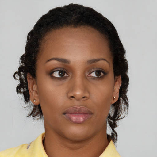Neutral black young-adult female with short  brown hair and brown eyes