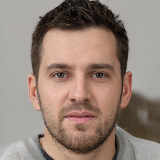 Neutral white young-adult male with short  brown hair and brown eyes