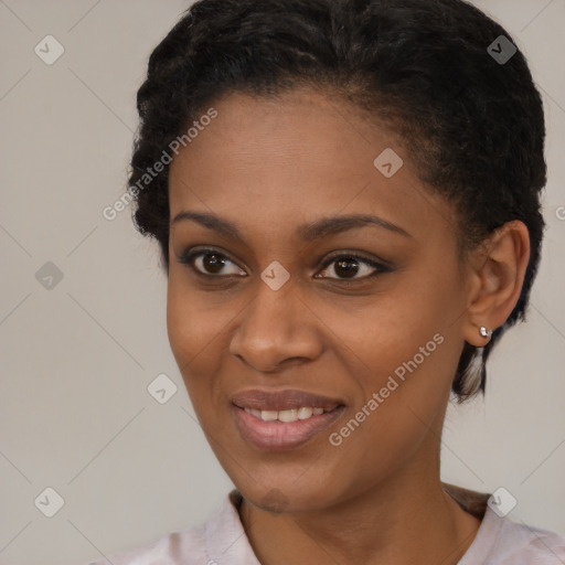 Joyful black young-adult female with short  brown hair and brown eyes