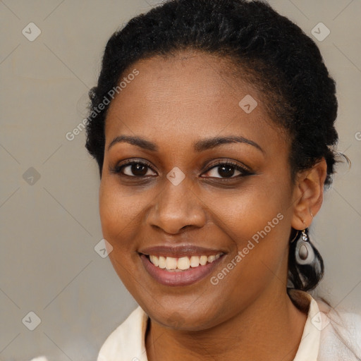 Joyful black young-adult female with short  brown hair and brown eyes