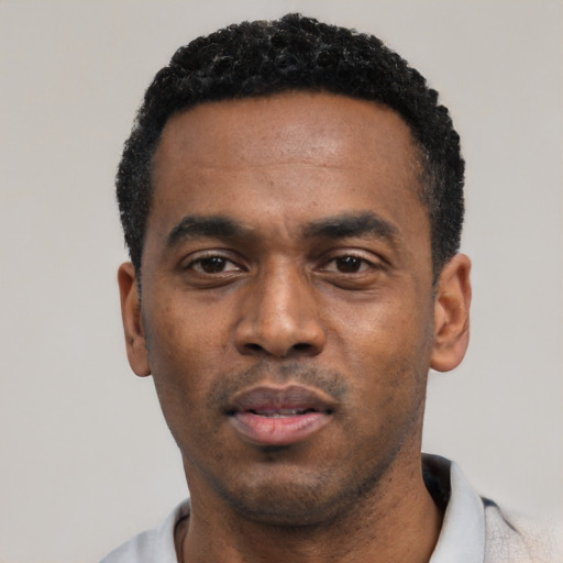 Neutral black young-adult male with short  black hair and brown eyes