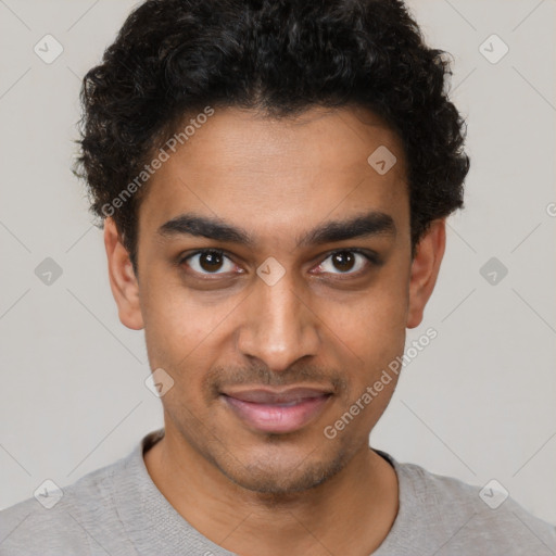 Joyful latino young-adult male with short  brown hair and brown eyes