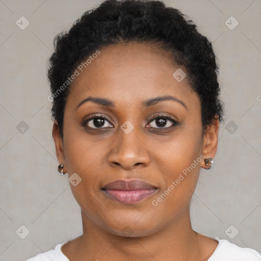 Joyful black young-adult female with short  black hair and brown eyes