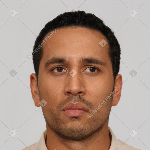 Neutral latino young-adult male with short  black hair and brown eyes