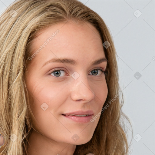 Joyful white young-adult female with long  brown hair and blue eyes