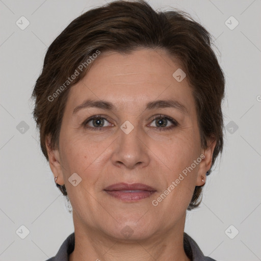 Joyful white adult female with short  brown hair and brown eyes