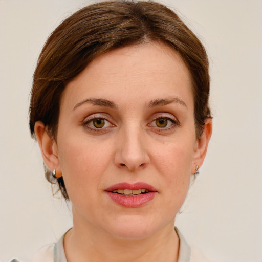 Joyful white young-adult female with medium  brown hair and blue eyes