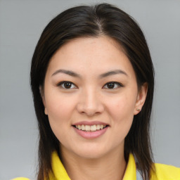 Joyful asian young-adult female with medium  brown hair and brown eyes