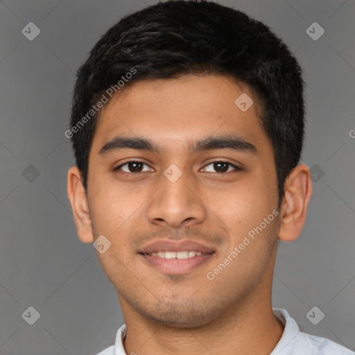 Joyful latino young-adult male with short  brown hair and brown eyes