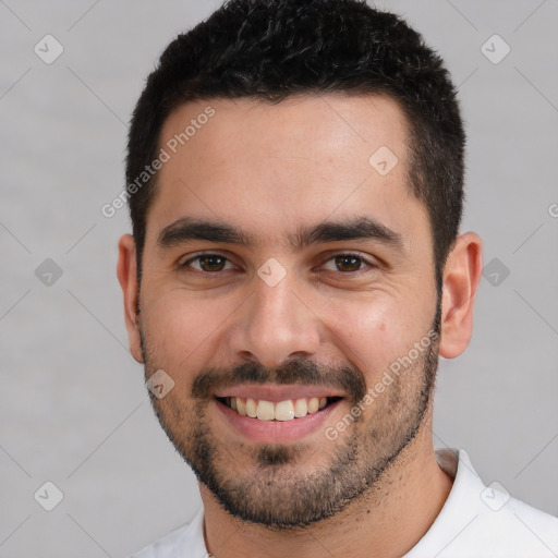 Joyful white young-adult male with short  black hair and brown eyes