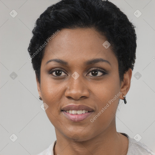 Joyful black young-adult female with short  black hair and brown eyes