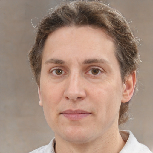 Joyful white adult male with medium  brown hair and brown eyes