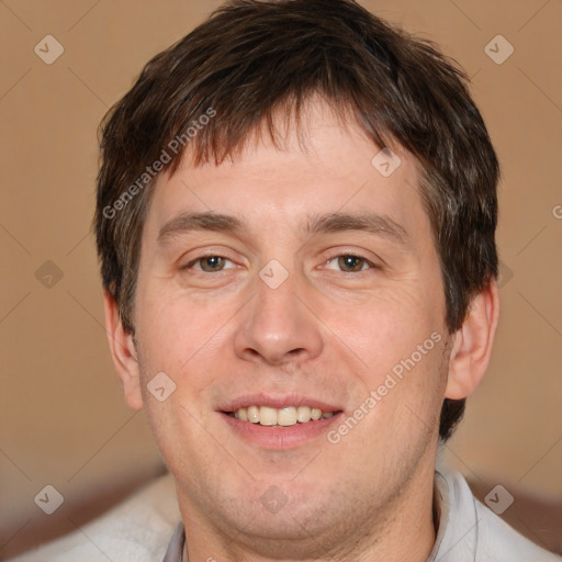 Joyful white adult male with short  brown hair and brown eyes