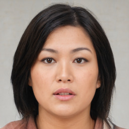 Neutral asian young-adult female with medium  brown hair and brown eyes