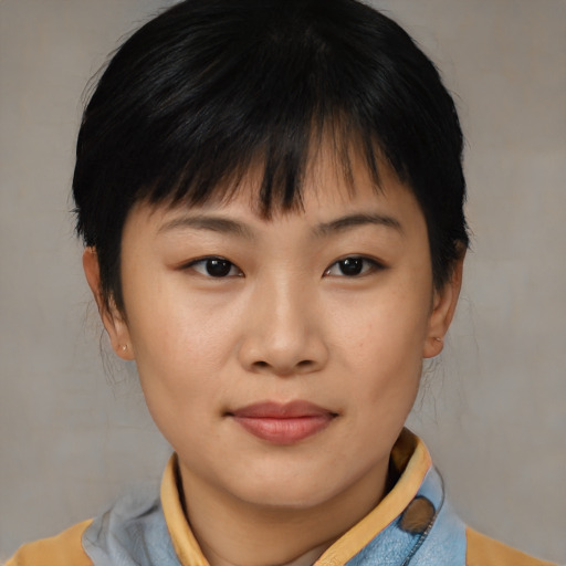 Joyful asian young-adult female with short  black hair and brown eyes