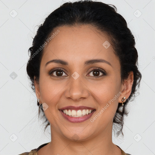 Joyful latino young-adult female with medium  brown hair and brown eyes