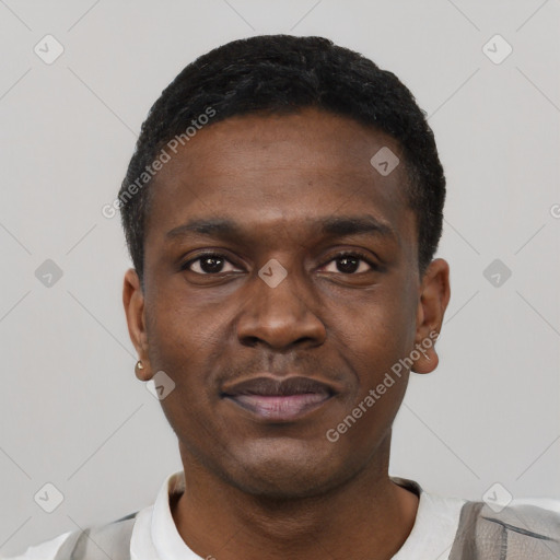 Joyful black young-adult male with short  black hair and brown eyes