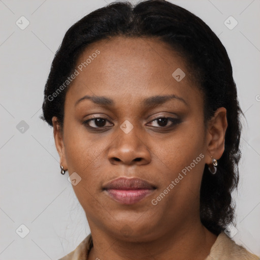 Joyful black adult female with short  brown hair and brown eyes