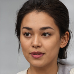 Joyful asian young-adult female with medium  brown hair and brown eyes