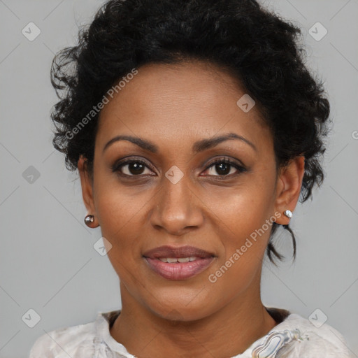 Joyful black adult female with short  black hair and brown eyes