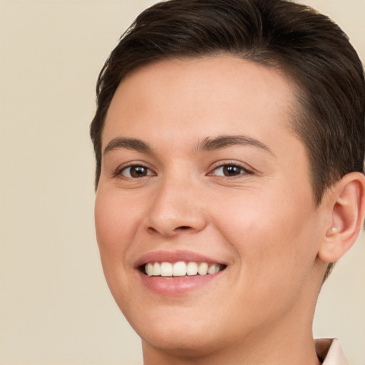 Joyful white young-adult female with short  brown hair and brown eyes