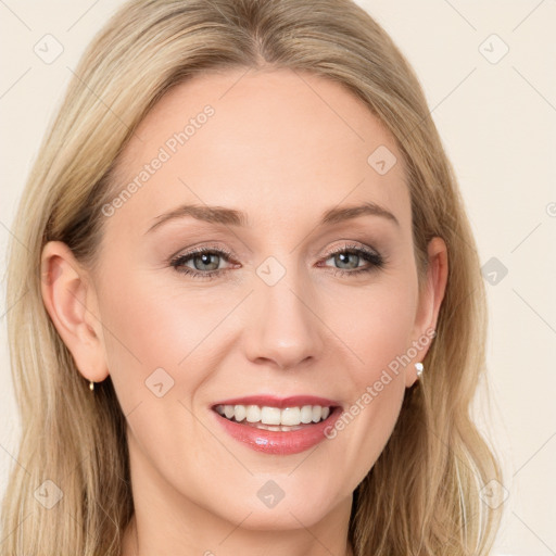 Joyful white young-adult female with long  brown hair and blue eyes