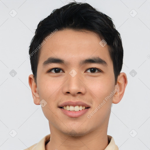 Joyful asian young-adult male with short  black hair and brown eyes