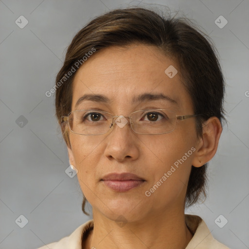 Joyful white adult female with medium  brown hair and brown eyes