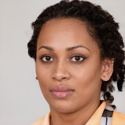 Neutral black young-adult female with medium  brown hair and brown eyes