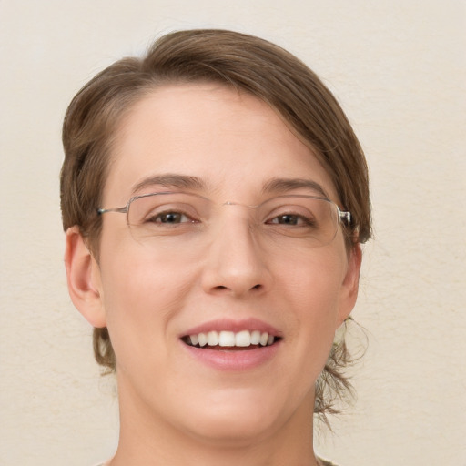 Joyful white young-adult female with medium  brown hair and brown eyes