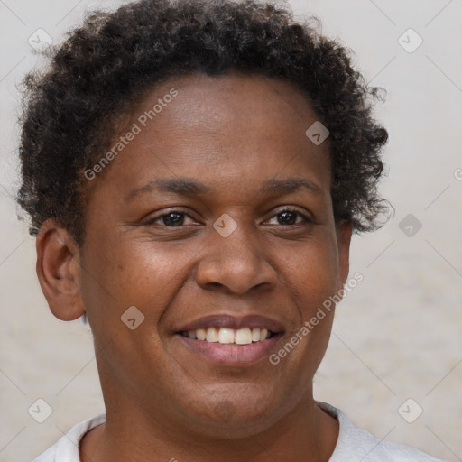 Joyful black adult female with short  brown hair and brown eyes