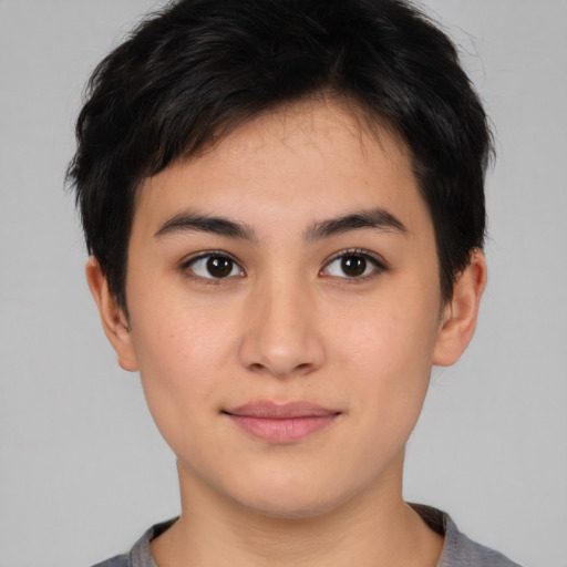 Joyful asian young-adult female with short  brown hair and brown eyes