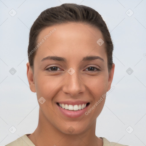 Joyful white young-adult female with short  brown hair and brown eyes