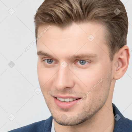 Joyful white young-adult male with short  brown hair and grey eyes