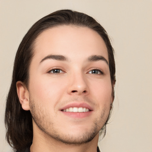 Neutral white young-adult male with long  brown hair and brown eyes