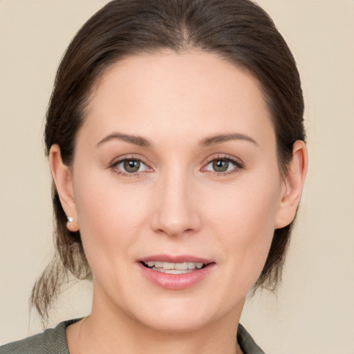 Joyful white young-adult female with medium  brown hair and brown eyes