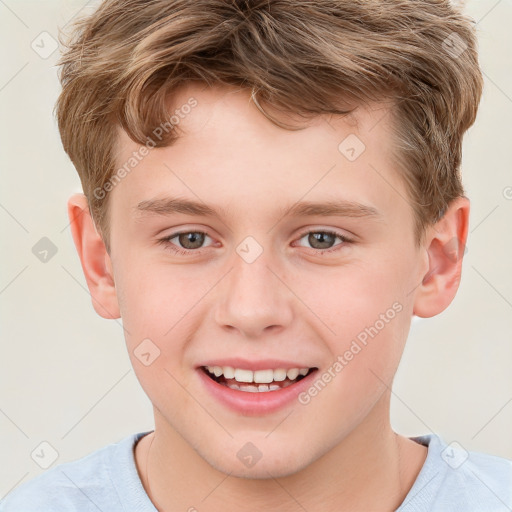 Joyful white child male with short  brown hair and grey eyes