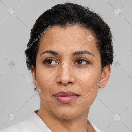 Joyful latino adult female with short  brown hair and brown eyes