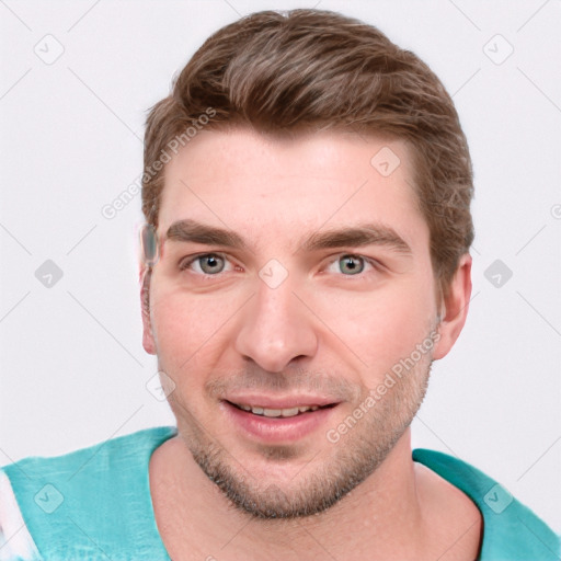Joyful white young-adult male with short  brown hair and blue eyes