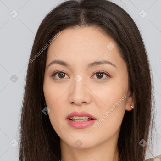 Joyful asian young-adult female with long  brown hair and brown eyes