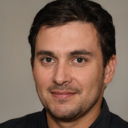 Joyful white adult male with short  brown hair and brown eyes