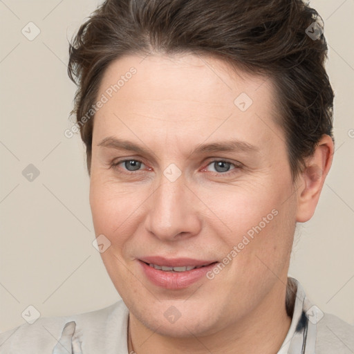 Joyful white adult female with short  brown hair and brown eyes