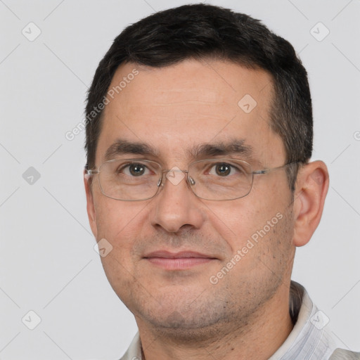 Joyful white adult male with short  brown hair and brown eyes