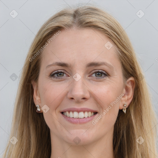 Joyful white adult female with long  brown hair and grey eyes